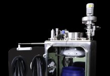 Secondary barrier glove box with continuous liner.